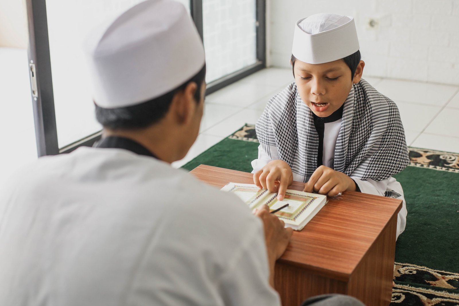 Muslim boy studying Quran